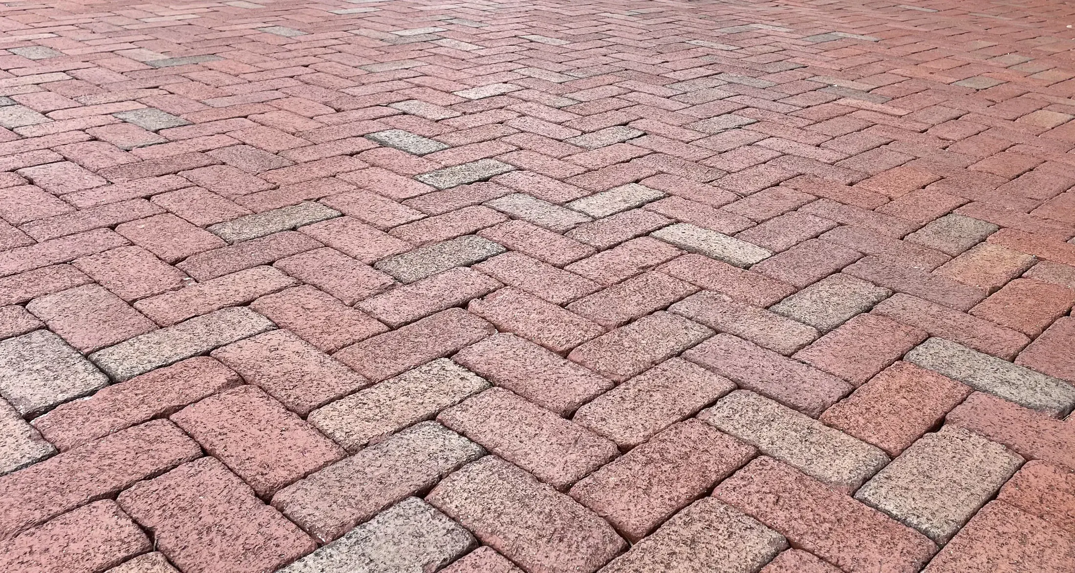 Close view of warm clay brick paving and its natural variation