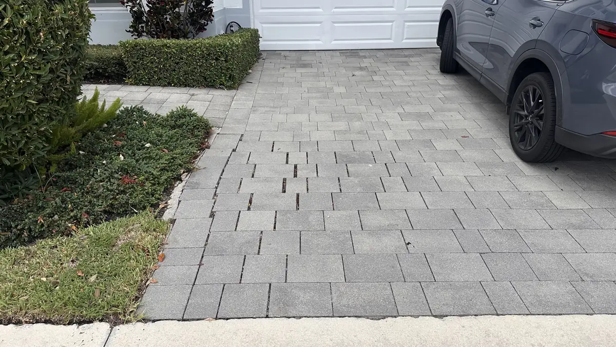 Aligned gray driveway pavers after a Boca Raton repair